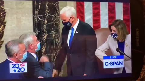 The Insurance Policy: Mike Pence, donning a blue tie, receives the Secret Coin 1/6/2021 hand shake.