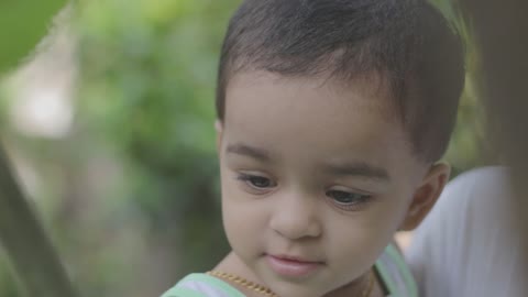 Watch the innocent smile of a baby outside the house