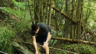 Man Falls Crossing Branch Over Stream