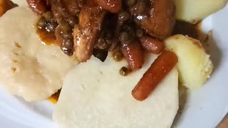 Stew chicken and cornmeal dumplings with yam and sweet potato