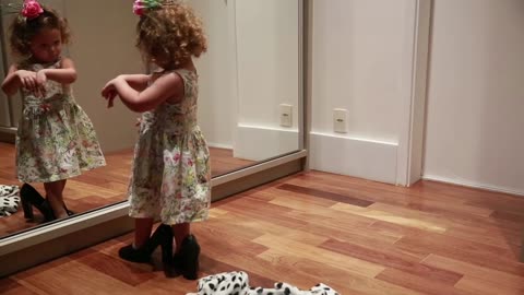Little Girl Dances in Front of Mirror .... Cute Moment