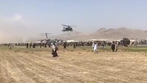Helicopters Forced to Clear Kabul Runway as Afghans Try to Flee Almost Certain Death from Taliban