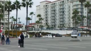 Helicopters flying landing in Huntington Beach CA Today.
