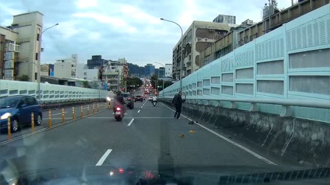 Scooter Man Slips In Traffic