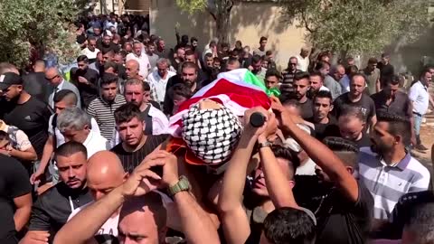 Crowds mourn Palestinian teen killed in Israeli raid