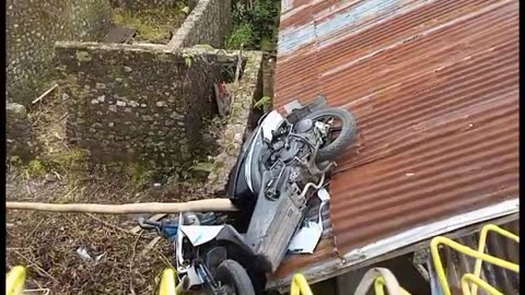 The motorbike experienced brake failure and plunged onto the roof of the house