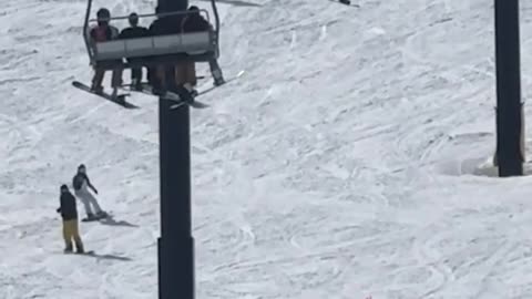 Horror moment teen snowboarder falls from chairlift