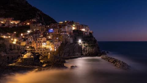 timelapse sequence of cinque terre italy the iconic village of manarola from day to night