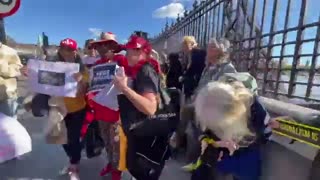 Julian Assange Supporters Form A Human Chain Around The UK Parliament Today