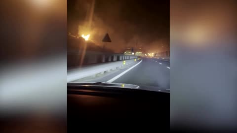 Motorists risk corridor of fire on Sicilian highway