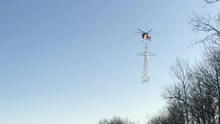 Talented Pilot Shows Amazing Skills Attaching Two Sections Of A Pylon