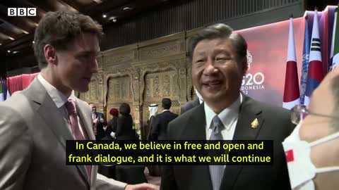 China and Canada leaders caught having tense exchange on camera - BBC News