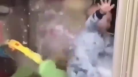 "Kid's Hilarious Reaction to Splashing Water!"