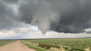 Storm Chaser Walks Towards Tornado