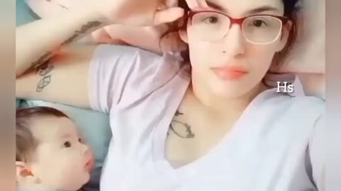 Adorable baby looking at her mom!