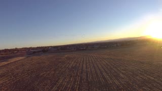 Flying Paramotor at Sunset with Geese