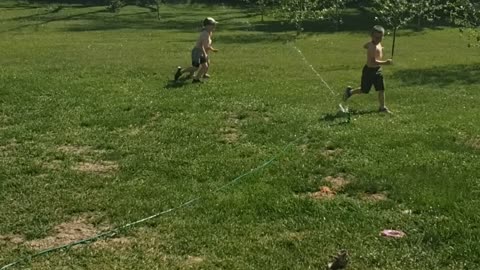 Fun on the Farm - enjoying the sprinkler on a hot day!