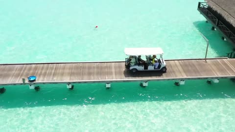 Beach golf cart on a wooden pier