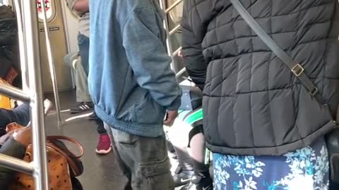Two men rap on subway station
