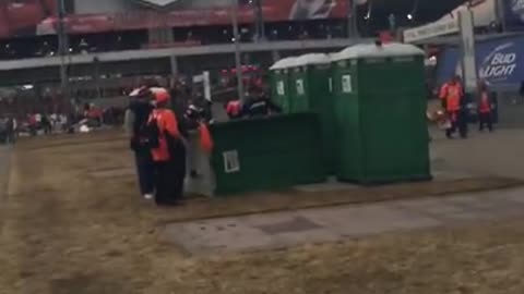 Broncos fan allegedly kicks over Porta-Potty with Patriots fan inside