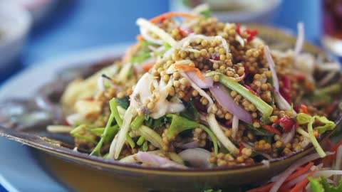 Thai cuisine seafood dish, mango papaya spicy salad with Horseshoe Crab (Limulidae) eggs