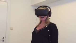 Girl wipes out while playing VR horror game