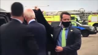 Biden appears to wave to an empty field