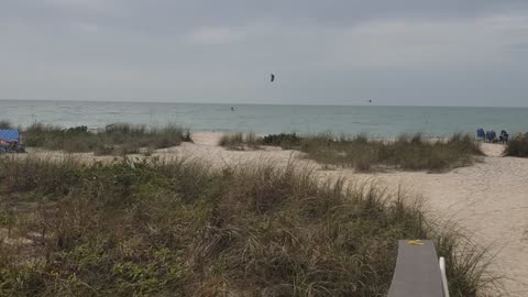 Dude on Wind Kite Sail Driven Hydrofoil Board
