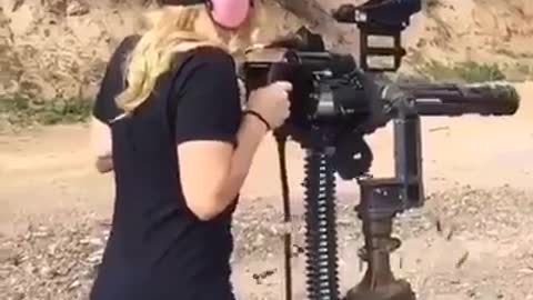 Girl and machine guns are lovely to be watch