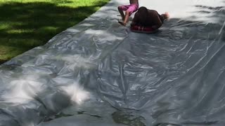 Kid Crashes on Slip and Slide