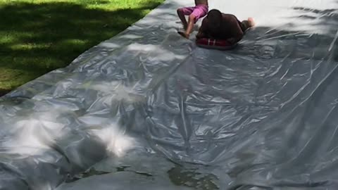 Kid Crashes on Slip and Slide