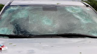 Woman Runs Outside During Hailstorm