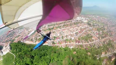 Hang gliding above citadel and back-country skiing