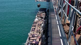 Aid trucks begin moving through Gaza pier, US says