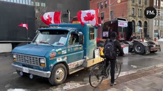 A Freedom Convoy participant blasts O Canada from his truck