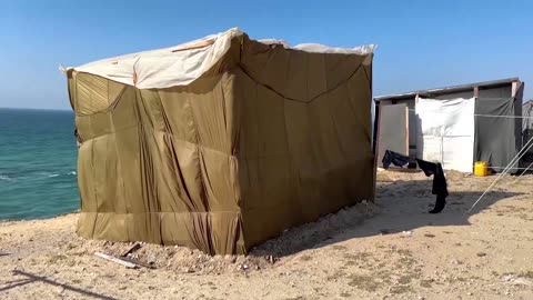 Displaced Gazan makes tent with airdrop parachute