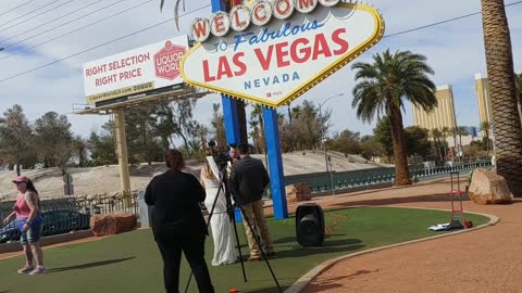 Elvis marries couple under the Welcome to Las Vegas Sign
