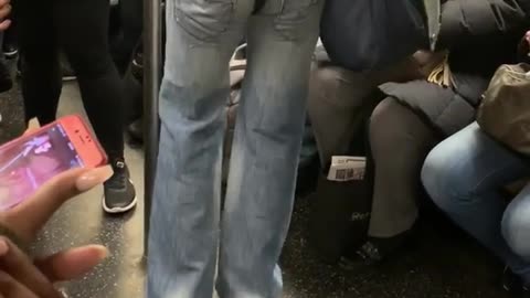 Woman wearing thong on her jeans dancing by herself in subway train