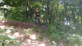 Boy Almost Crashes His Bike But His Mom Saves Him While Holding A Baby