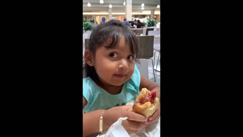 Little girl adorably critiques a sandwich