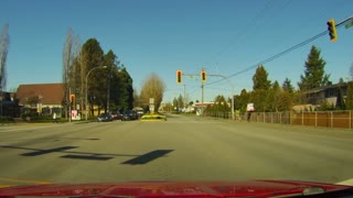 Car Ignores Red Light and Narrowly Misses Pedestrian