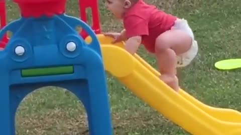 Funny babies playing in park