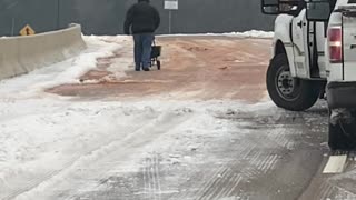 Salting a Snowy Bridge in Mississippi