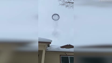 Woman Surprised by Strange Ring of Smoke in the Sky