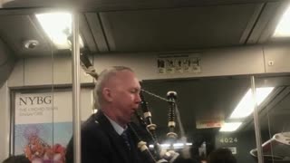Man plays bagpipes on st. patrick's day on subway train