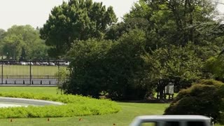 President Biden Drives an Electric Jeep on the White House South Lawn