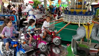 Spencer driving a fire truck at Adventureland 20170528_145048