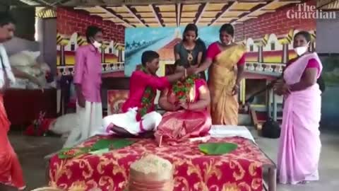Indian couple float to wedding in cooking pot after floods in Kerala