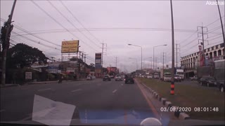 Metal Scraps Fall From a Truck into Car in Traffic