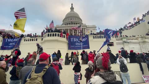 Patriots singing the national anthem of the United States of America at the capitol protest